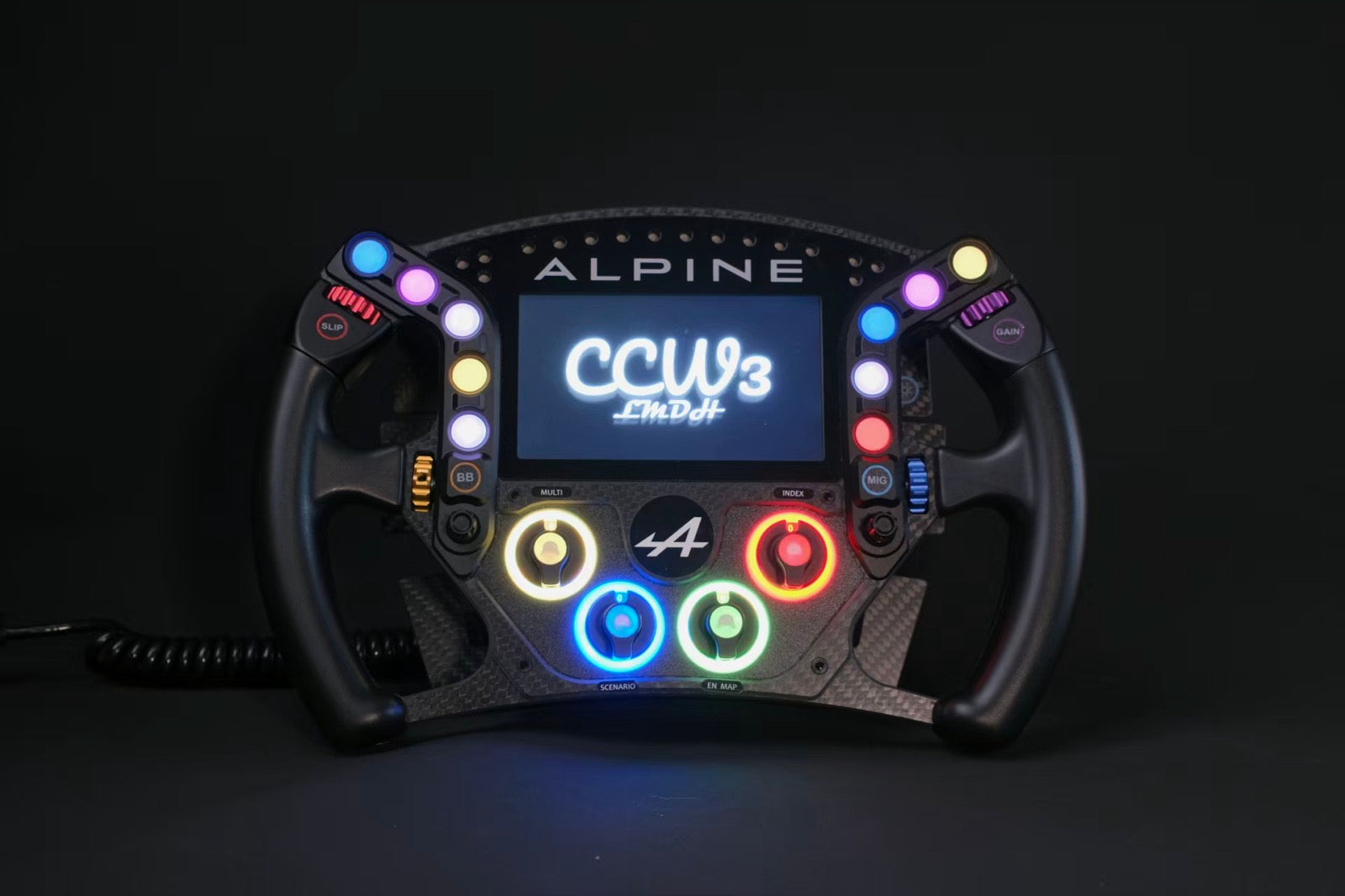 Racing steering wheel with illuminated controls photographed against a dark backdrop