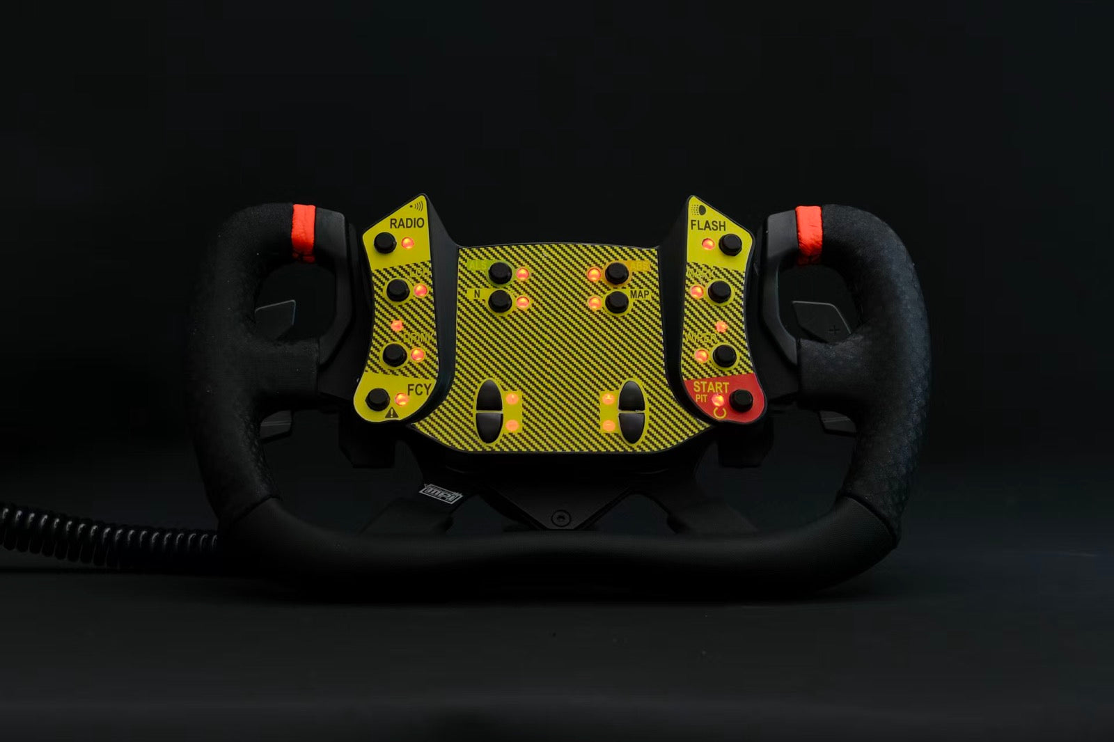 Yellow racing wheel product photographed against a dark studio background